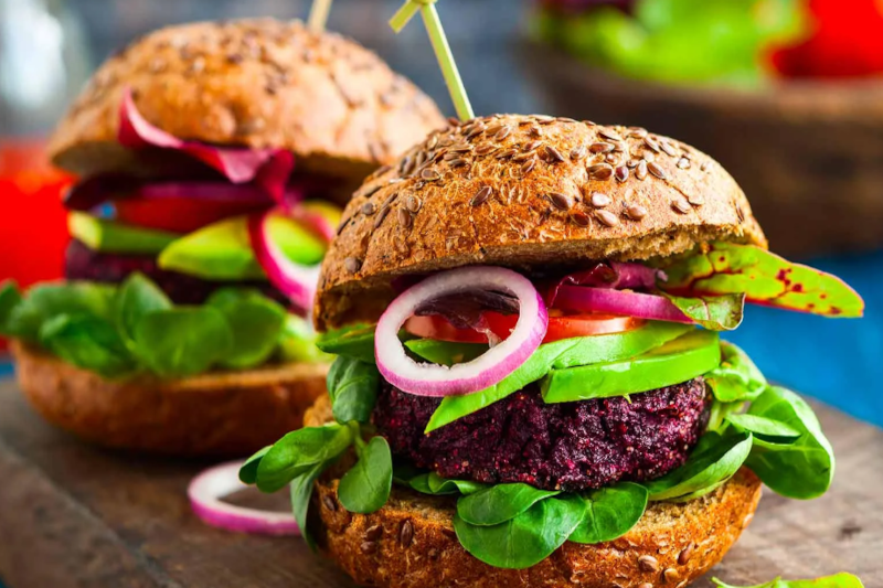 a beet and mushroom burger on a bread bun