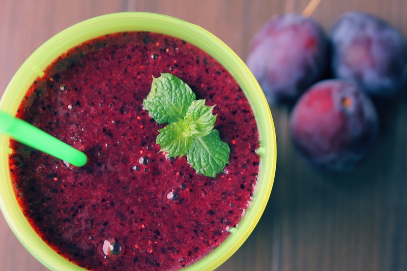 a glass of beet and berries smoothie