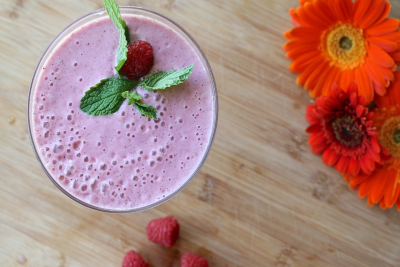 a glass of raspberry smoothie